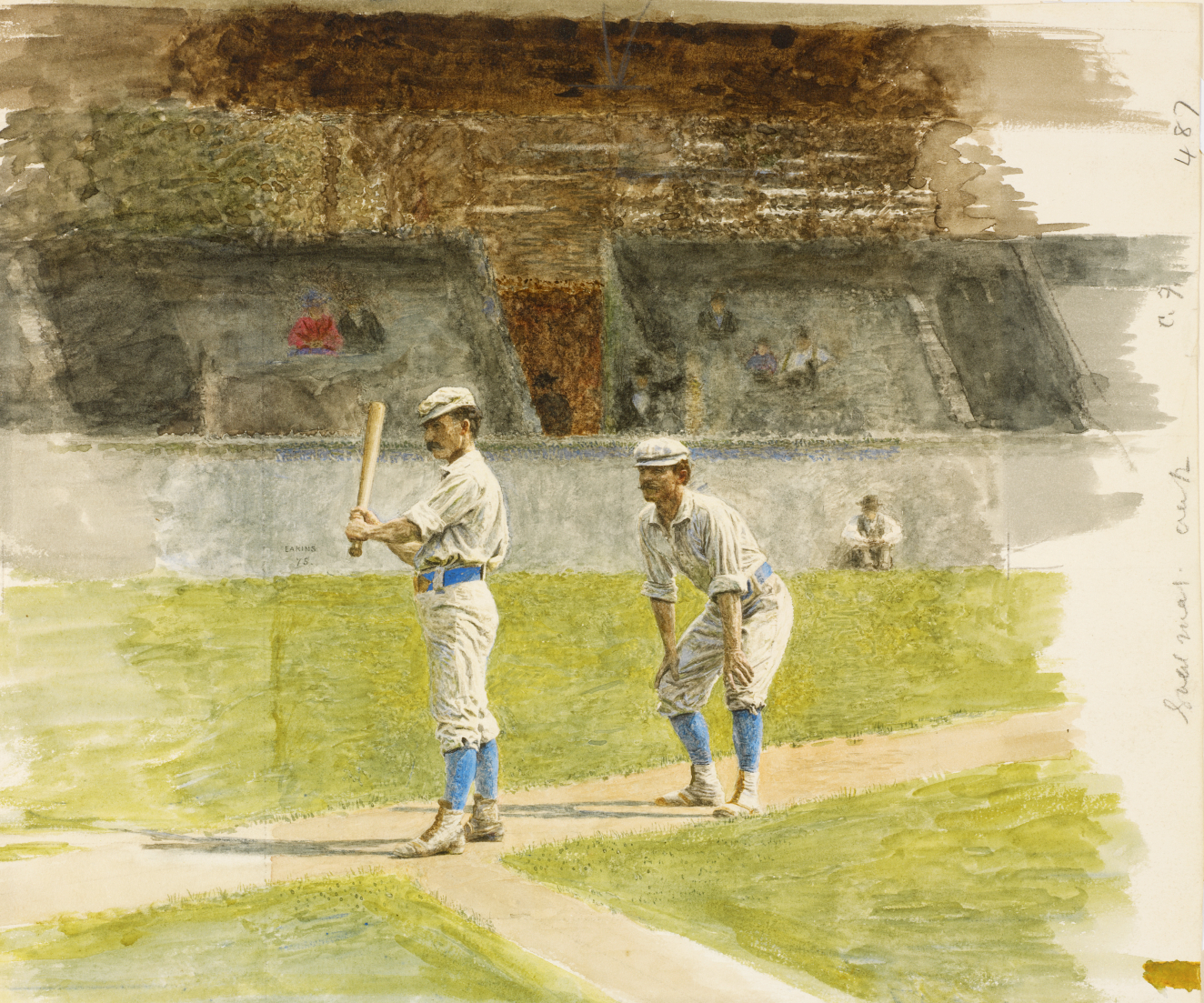 Two baseball players in old fashioned uniforms with blue socks stand on a dusty field with faded spectators in wooden bleachers. 
