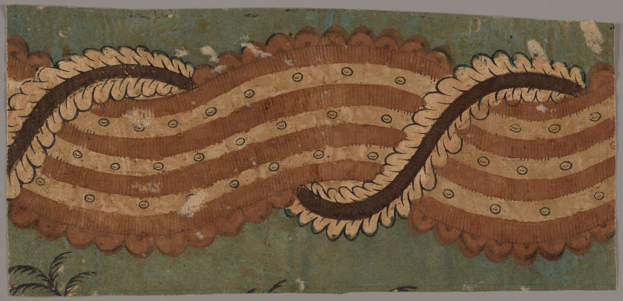 Segment of yellowed wallpaper featuring an undulating red and white motif bordered by intricate curved details, and an ornamental spiral wrapping around the motif; set against a faded blue backdrop.