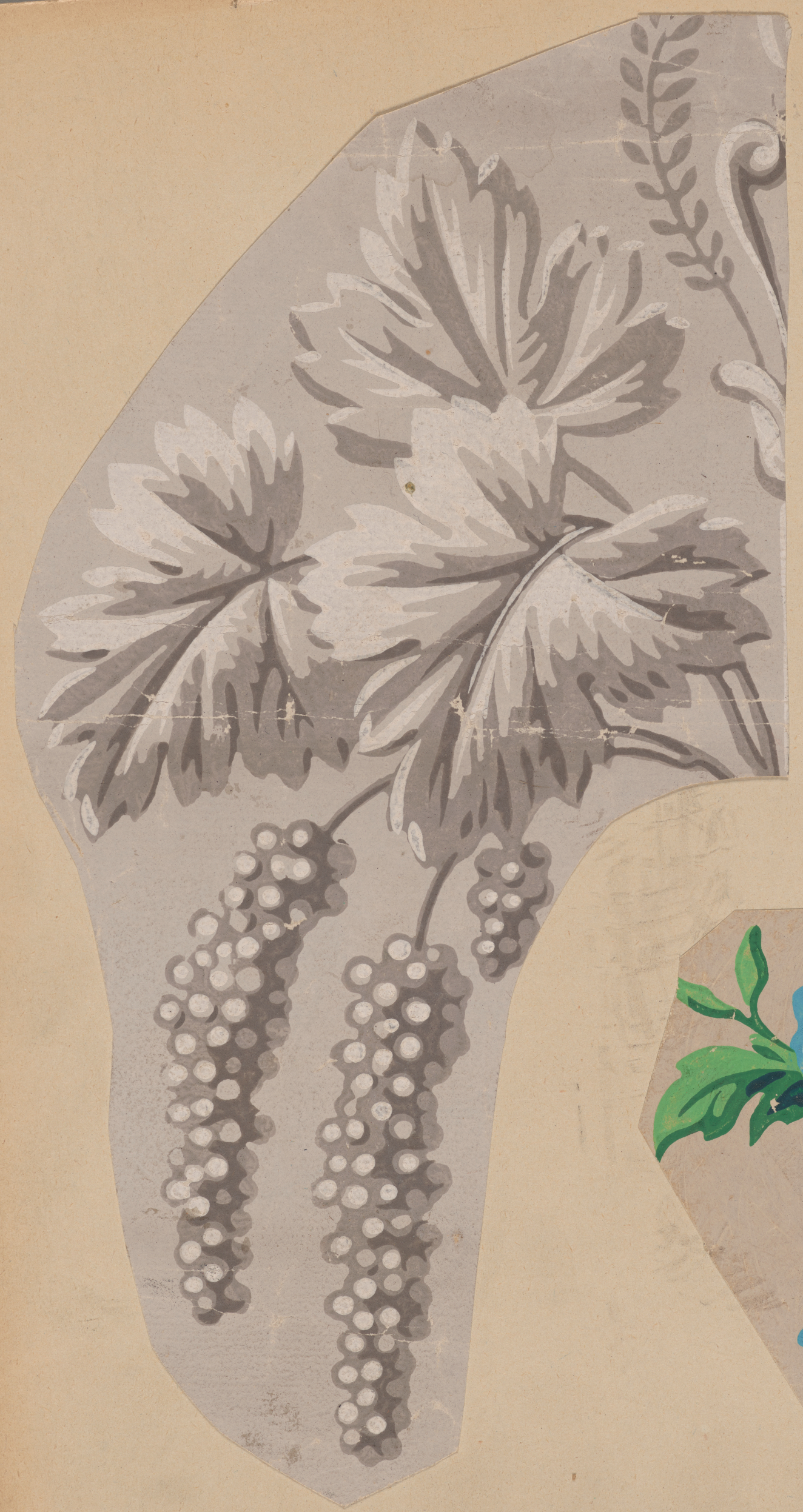 Gray decorative motif on top of an off white background. Three subtly shaded leaves sit over three grape clusters curving down to the left.