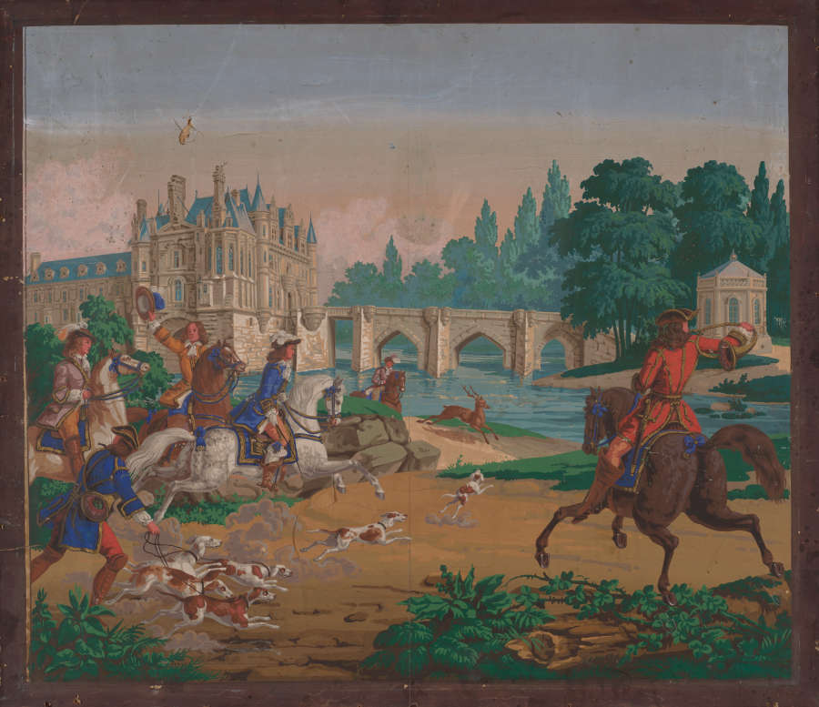 Lively print of unleashed dogs and six well dressed figures, five on horseback and one with multiple leashed dogs, speedily coming towards a deer running shoreside. A large castle with a bridge and gazebo are in the distance.