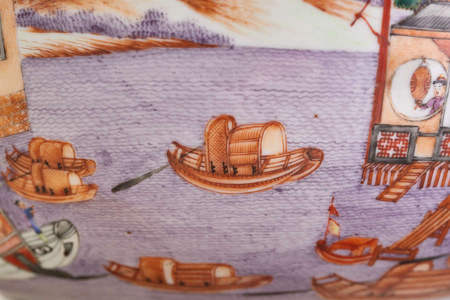 A painted ceramic scene depicting multiple wooden boats with coverings and a figure in a circular window on a docked structure.