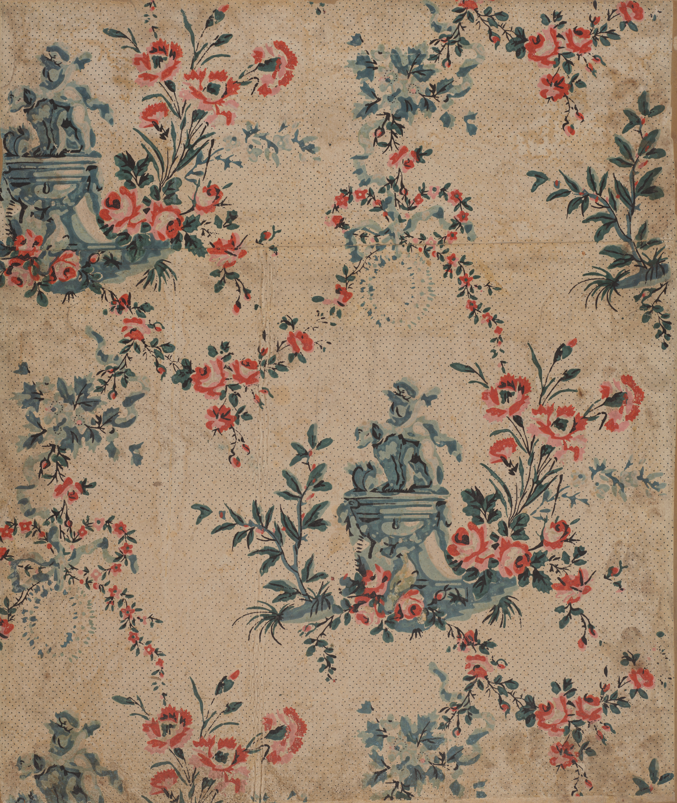 Aged, polka-dotted cream wallpaper with repeating light gray winged baby statues standing on a pedestal. Stemmed salmon pink flowers and floral garlands, which vary in size, surround the pedestal.