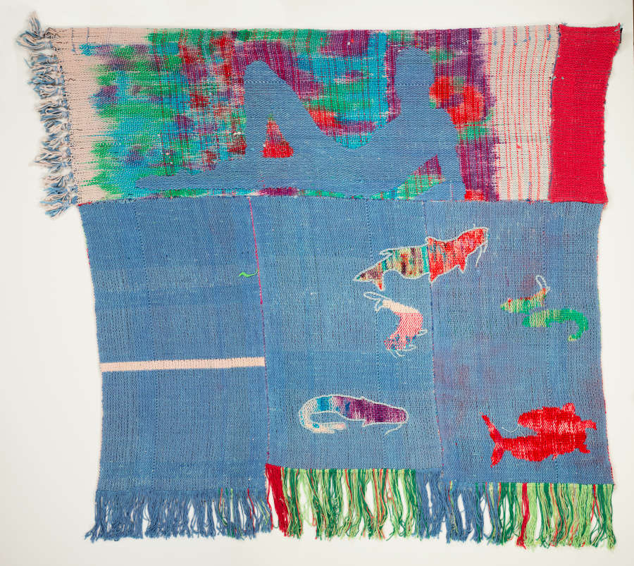 A collage constructed from four rectangular pieces of cloth featuring bright patterned silhouettes of fishes and a blue recumbent man against a patterned block. Two sides are frilled.