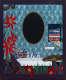 Vibrant painting of a bathroom scene with a black oval mirror, patterned blue wallpaper, folded towels, and red flowers, surrounding a white sink with toiletries scattered atop it. 