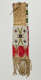 Long deerskin case with geometrically patterned white, red, blue, yellow, and green beading on the fringed bottom half as well as the sides. A string tie secures its mouth.