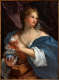 A fair-skinned woman with blond curls and rosy cheeks, draped in flowing blue, white, and brown robes, gazes to the right and holds an ornament above a small ceramic vessel.