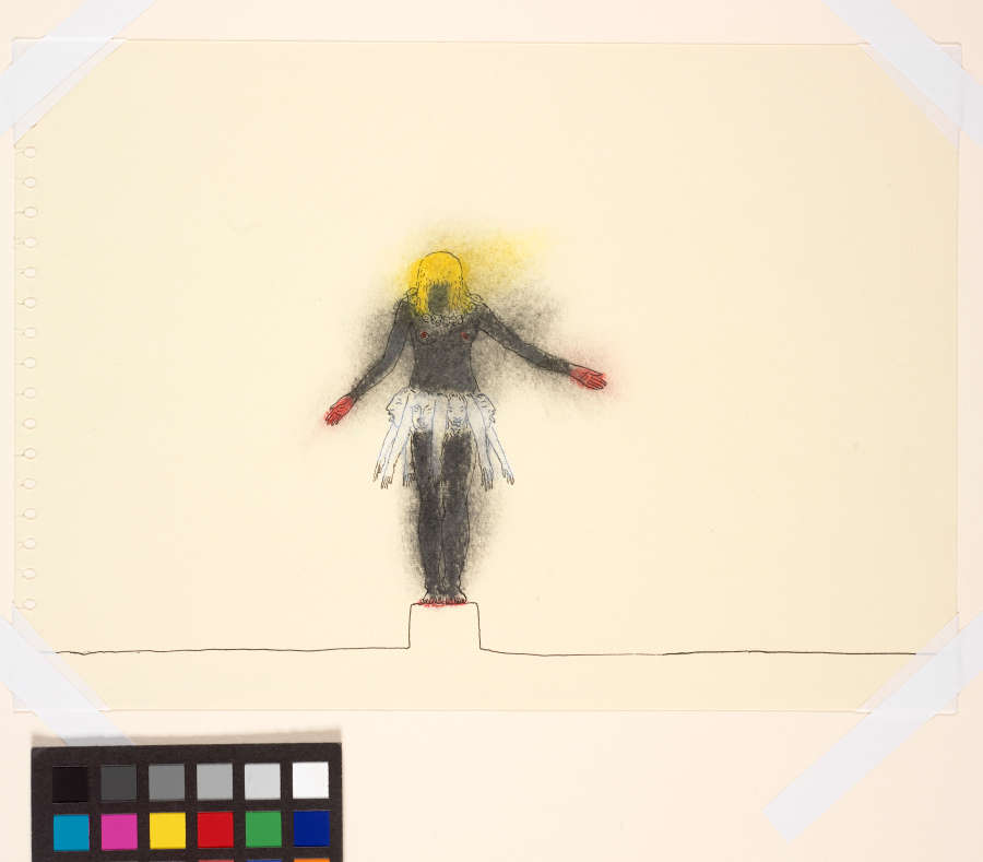At the center of a cream paper, a drawing of a nude woman in gray with yellow hair. A skirt of white heads and arms juts out from her hips.
