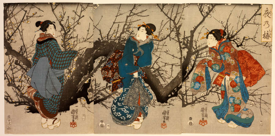 A three paneled woodblock print of three women in intricate kimonos among tree branches with small white flowers. The beige background features calligraphy script at the bottom of each panel.