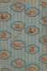 Vertically striped blue and white patterned wallcovering with repeating motifs of animals, figures, and buildings, in orange, within blue hexagonal frames overtop.