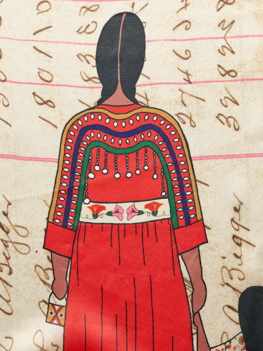 Scarf detail, showing the back of a figure with braided hair in a red patterned dress holding hands with a smaller figure. The background features pink lines and scripture patterning.