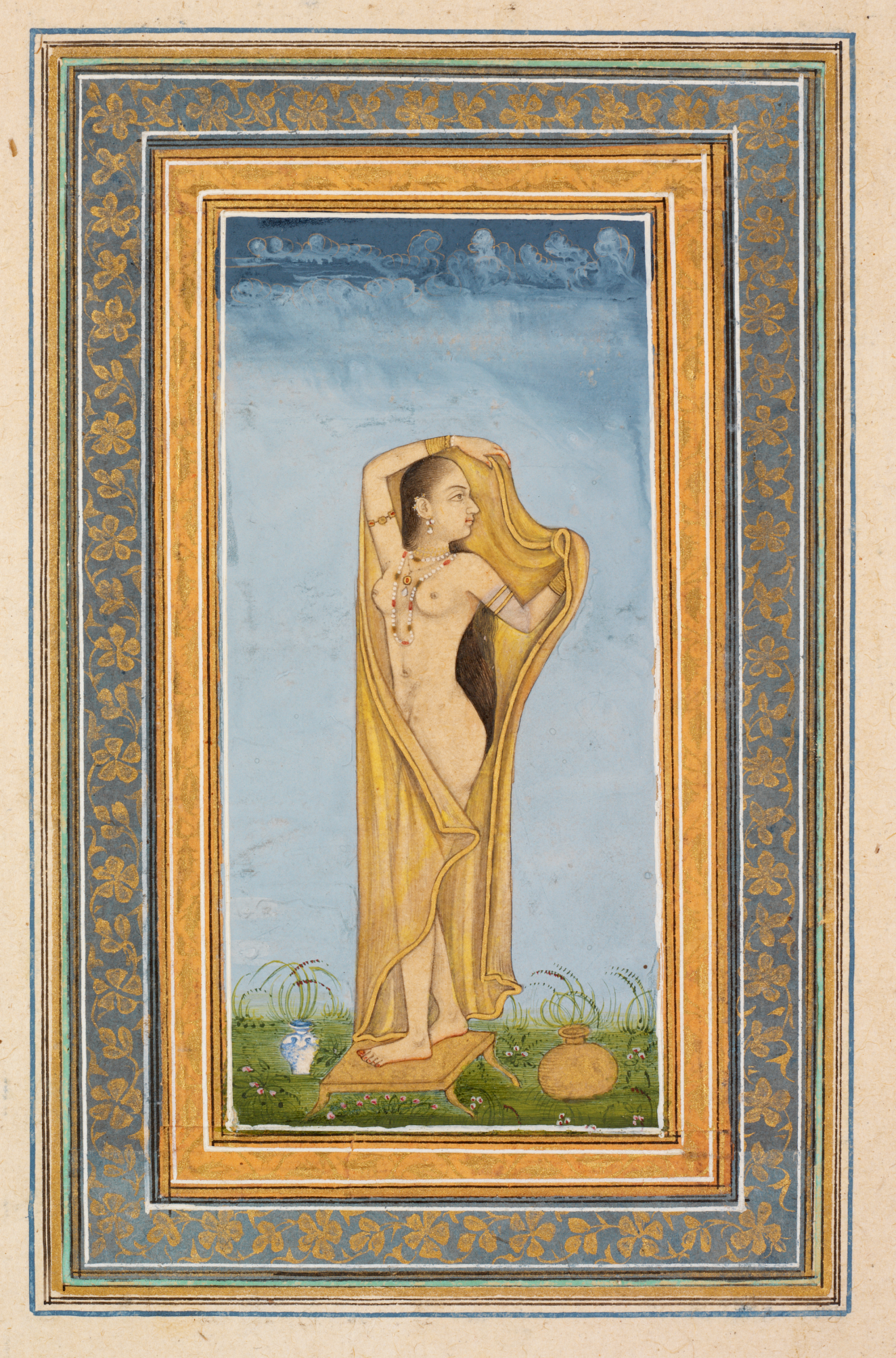 A detailed miniature painting of a woman with a golden shawl, standing barefoot on grass, framed by intricate blue and gold floral borders.