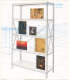 A wireframe bookshelf sketched in a blue “40-50 GRID” perspective space, containing various eclectic images including a photo of a building engulfed in smoke, book covers, black-and-white portrait, and sunset. 