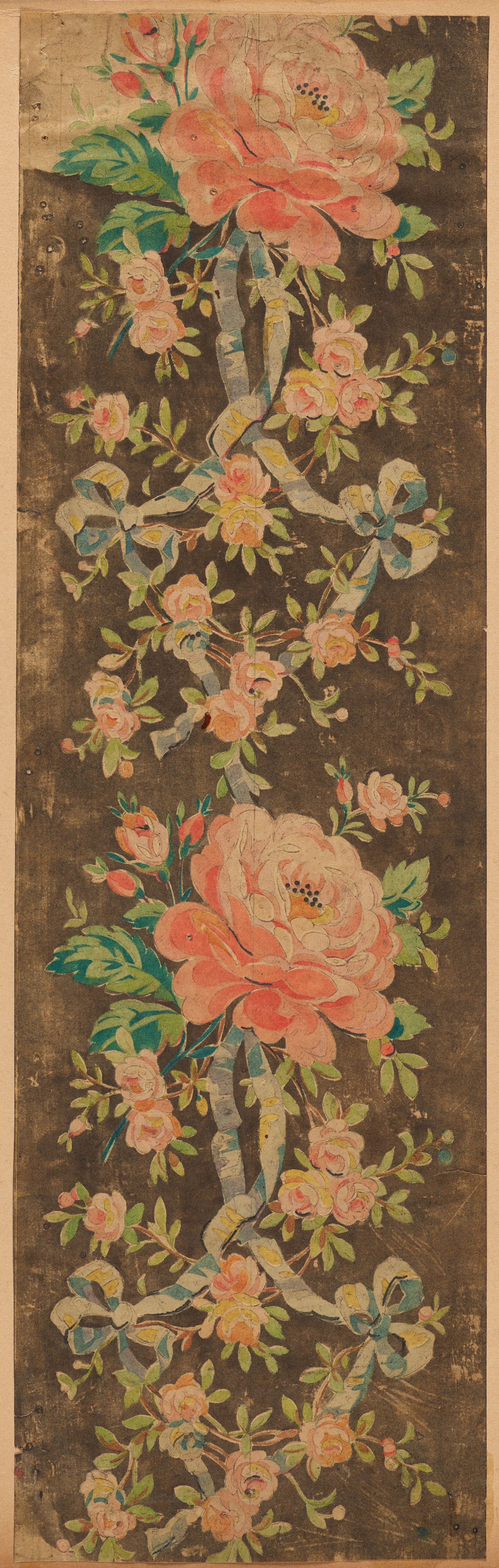 Aged, brown wallpaper with repeating motifs of large pink flowers surrounded by smaller pink flower bouquets, green leaves, and a faint blue knotted ribbon.