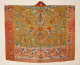 An ornate, orange robe with a rectangular panel in golden yellow depicting a central pagoda, dragons and birds in gold, blue, and red, with a lower section of embroidered calligraphy.