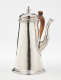 A silver chocolate pot with a spout, hinged lid, and fruitwood handle that is 90 degrees from the spout.
