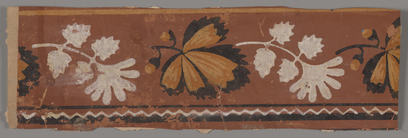 Alternating white and orange and black leaves set on a red-brown background with a white zigzag between thin black lines along the bottom edge.