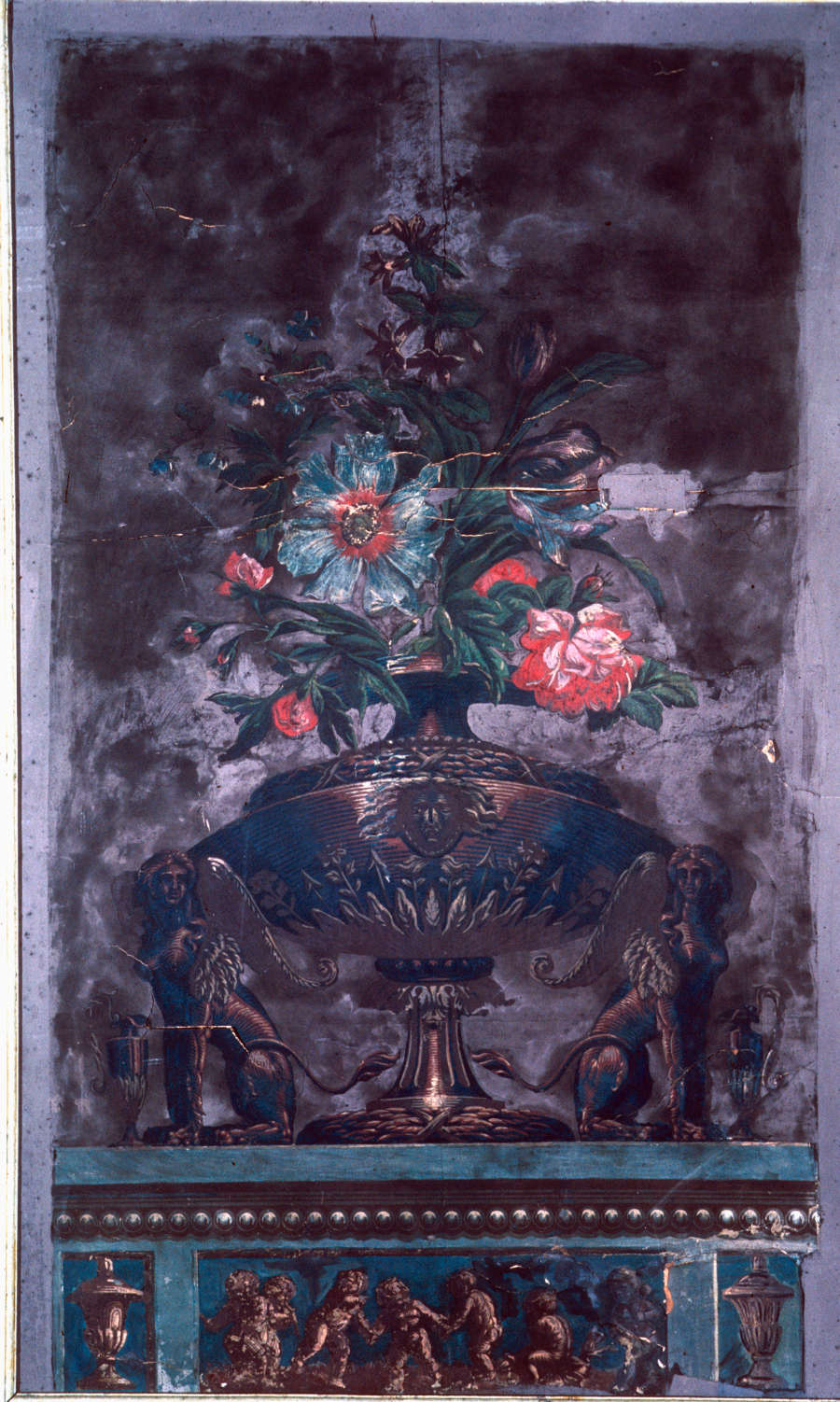 Weathered, dark-brown rectangular painting of a decorative vase containing red flowers and large leaves, between two mythological winged figures, on a turquoise table with etched winged babies and gold embellishments. 