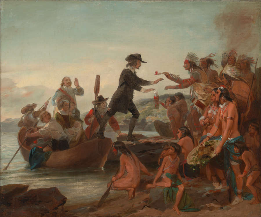 A fully clothed European man steps out of a crowded longboat onto the shore, where he is greeted by several Indigenous people bearing gifts, who are stereotypically depicted as minimally clothed.