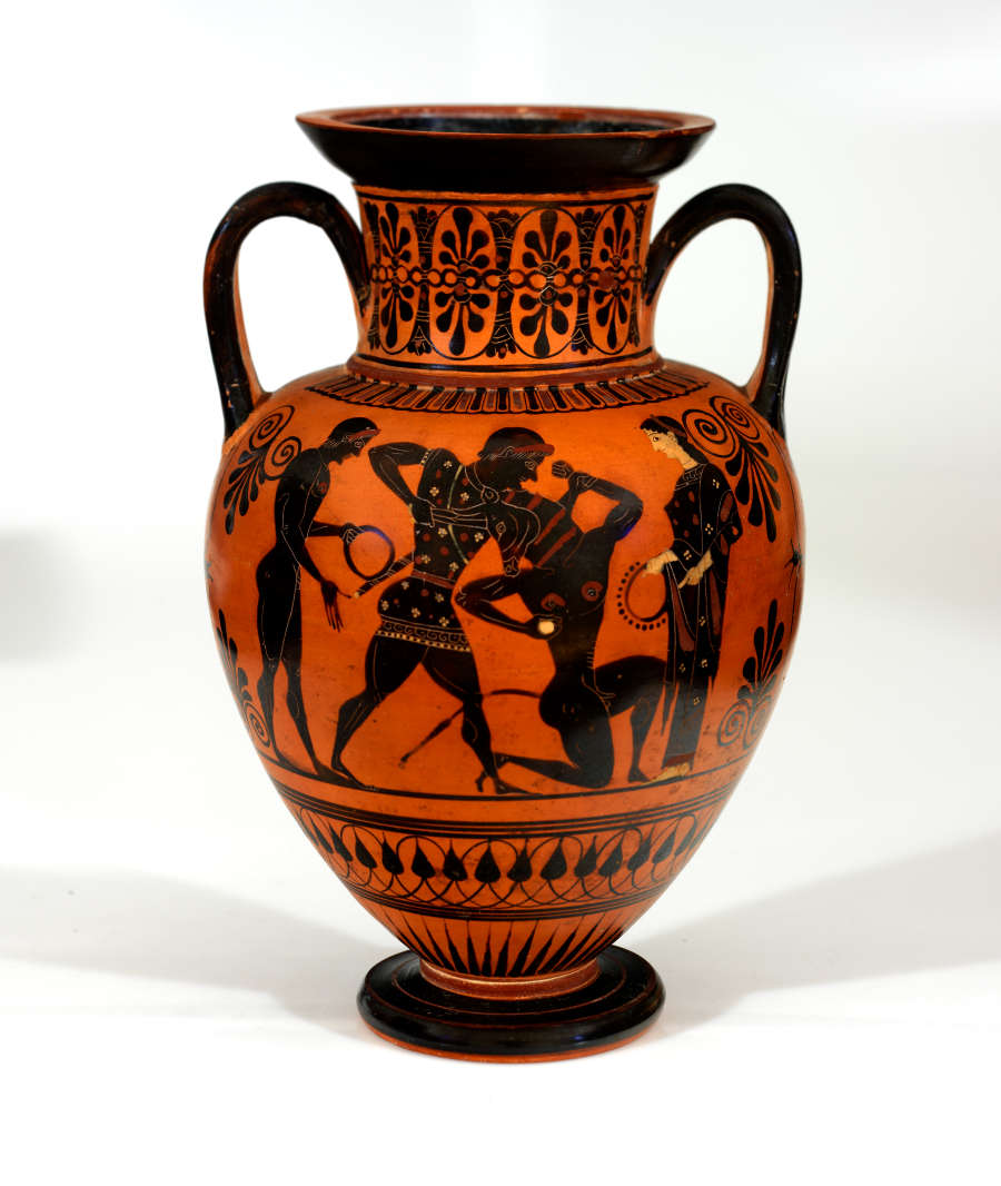 Terracotta onion-shaped jar with two black arched handles and black stripes, decorated with floral and geometric patterns and illustrations of two men battling each other with two onlookers