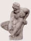 Monochrome image of a realistically carved statue depicting a muscular, bearded man sitting and leaning over to hold a vessel with a creatures face situated between his legs.