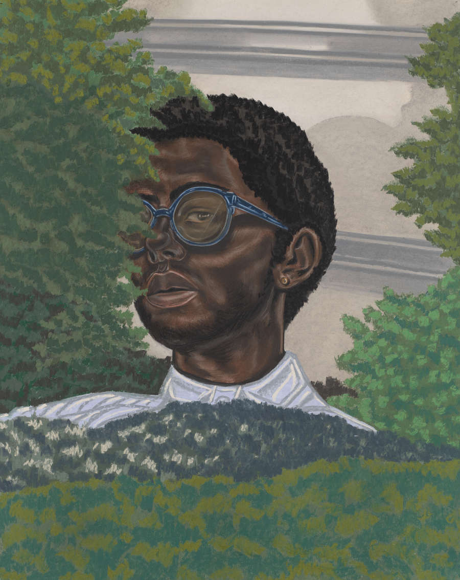 A portrait of a dark-skinned Black person wearing a collared shirt and blue-rimmed glasses. A small portion of their face is hidden by the lush greenery that surrounds them.