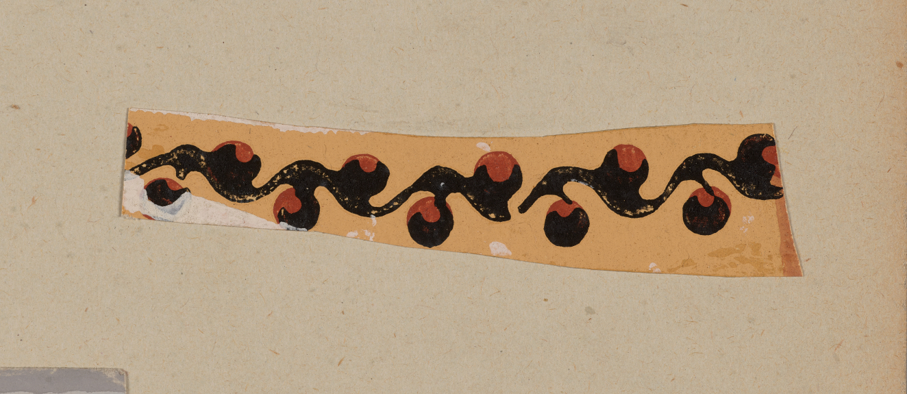 Yellow decorative design on a neutral background. Depicts a black swirling vine pattern with protruding circular forms and orange accents.