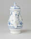 A white chocolate pot with delicate blue decorations with ribbed body, spout, handle, and foot.