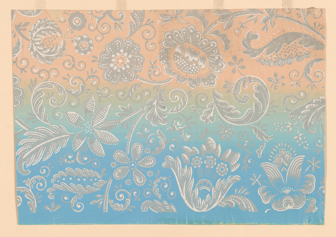 Orange, green and blue wallpaper with a gray and white floral pattern throughout, made out of swirls, feather-like leaves, and round oblong flowers.