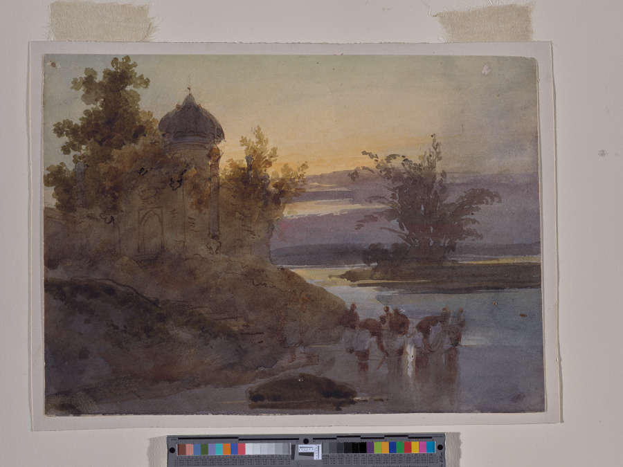 A watercolor and ink painting of a violet and yellow sunset over India’s Ganges River. A dome topped building sits atop the bank, with figures bathing in the river below.