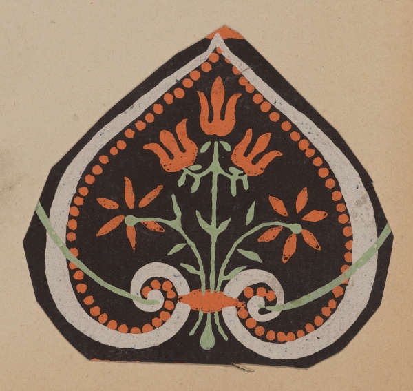 A teardrop-shaped motif with orange flowers with light green stems bordered by orange dotted patterns and white scrolls on a dark background.