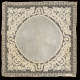Square of delicate white fabric on a black backdrop with a lacy border. Features detailed embroidery of flower and leaf patterns surrounding a circle of unornamented fabric.