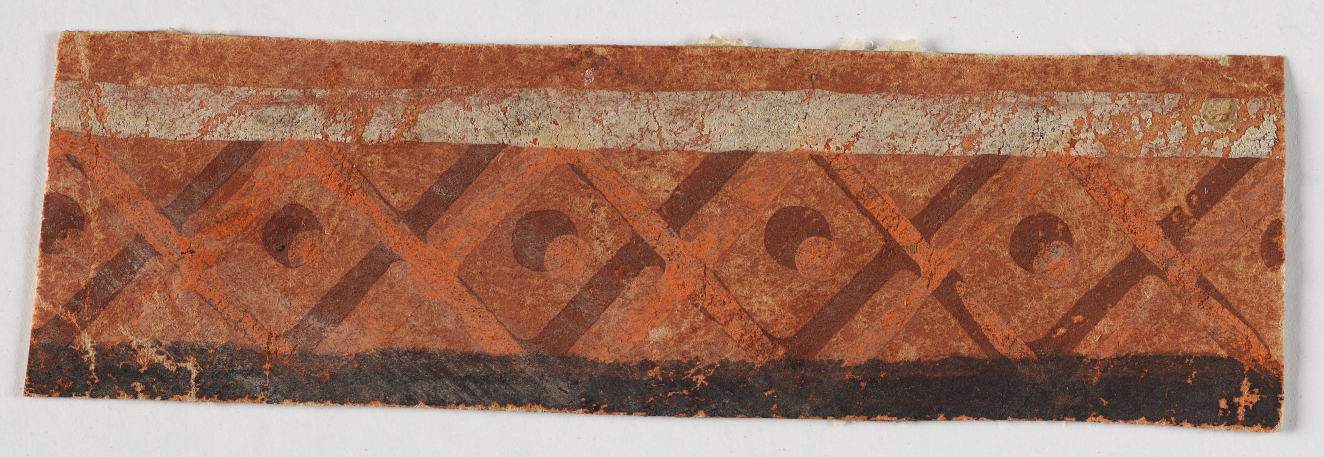 Horizontal strip featuring a repeating shaded diamond pattern with shaded circles in the center shades of orange between a pale upper stripe and a black lower stripe.