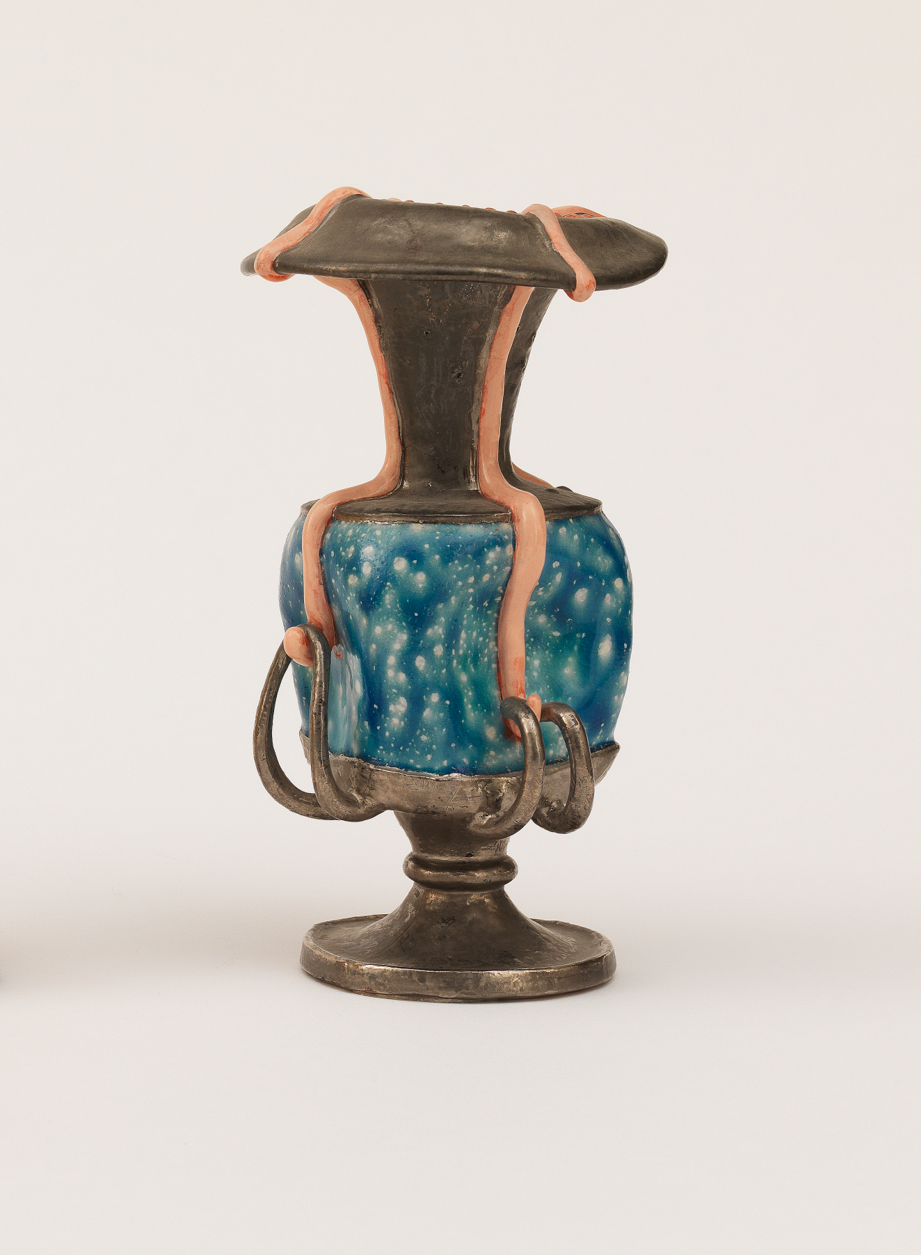 Tall ceramic urn with a metallic finish, wrapped around the center with a panel of bright, dappled blue and accented by pink stripes that curve around the body and handles.