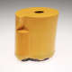 A glossy yellow cylindrical ceramic vessel with a small hole cut into the top, an irregular geometric cutout on the side, and a textured black base.