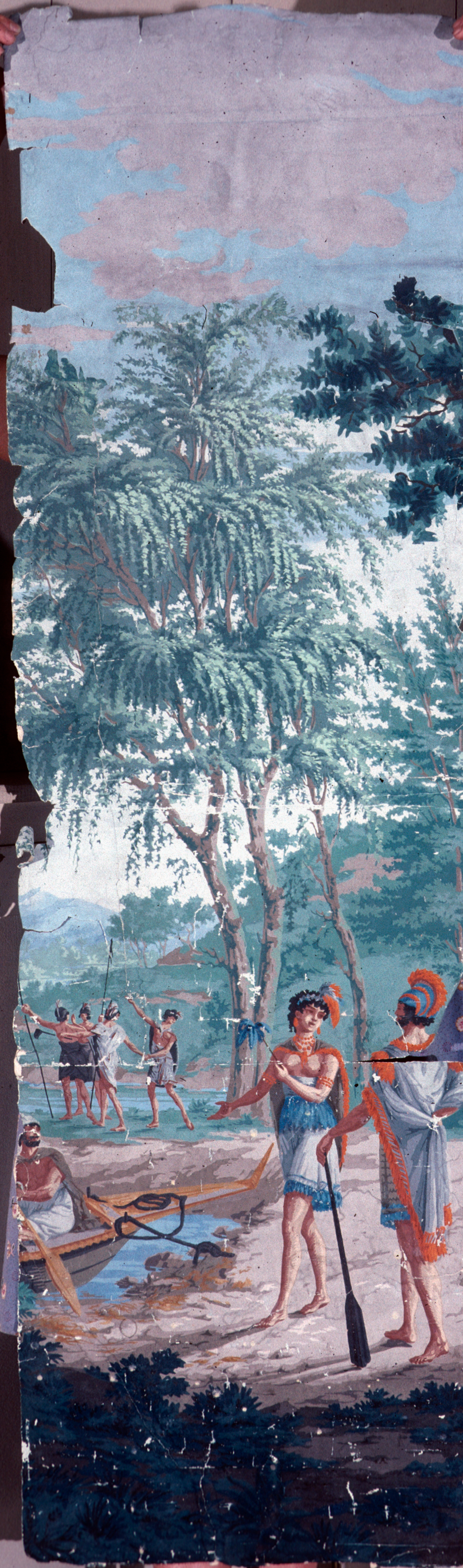 Tall, vertical painting fragment with signs of weathering showing leisurely figures by a riverbank surrounded by lush tropical foliage and a clear sky with hazy mountains in the distance.