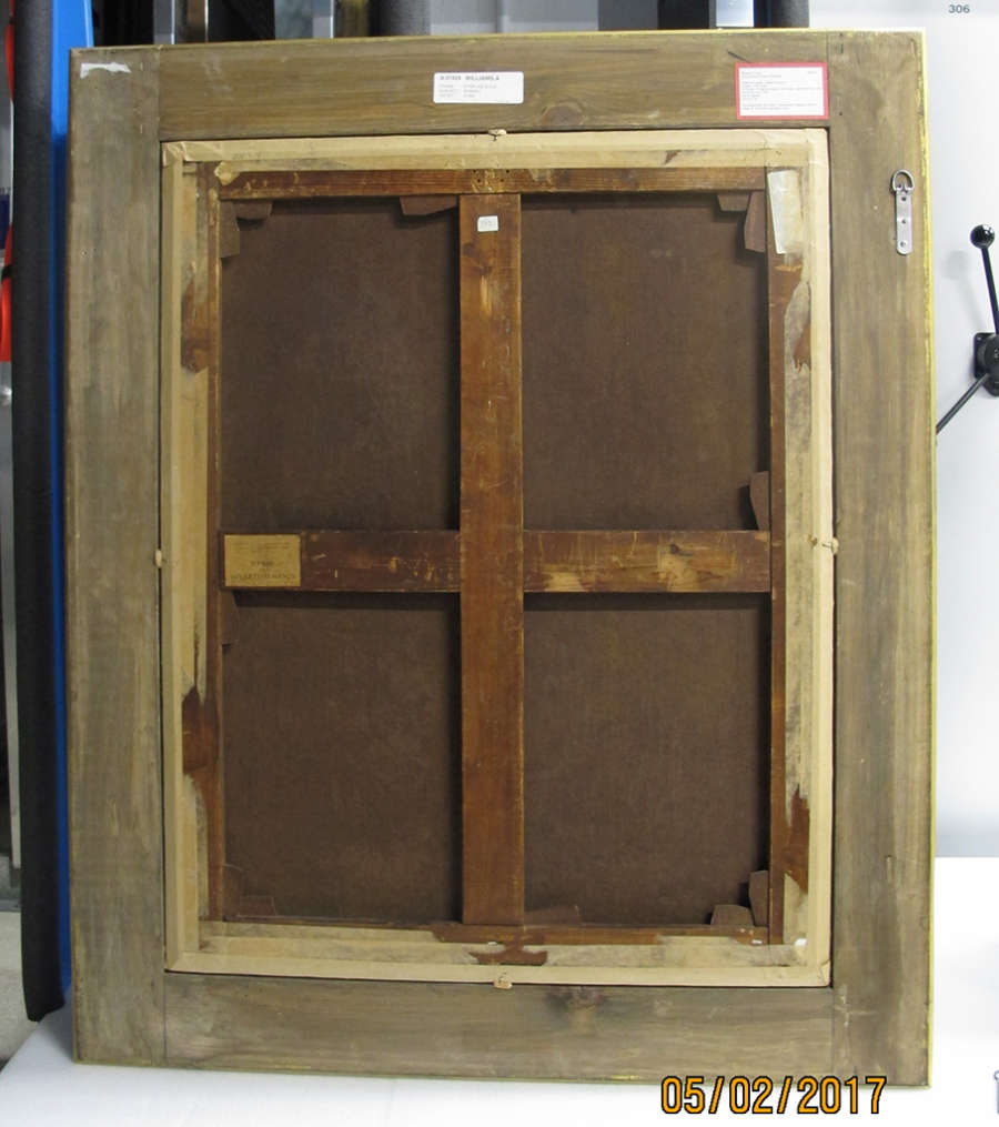 A wooden frame on the back of a painting with two crossed wooden support pieces.
