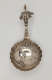  A silver caddy spoon with figurative and sculptural elements.