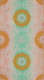 Symmetrical orange medallions reminiscent of mandalas arranged in a diagonal grid atop a psychedelic gradient of mint green and peach.