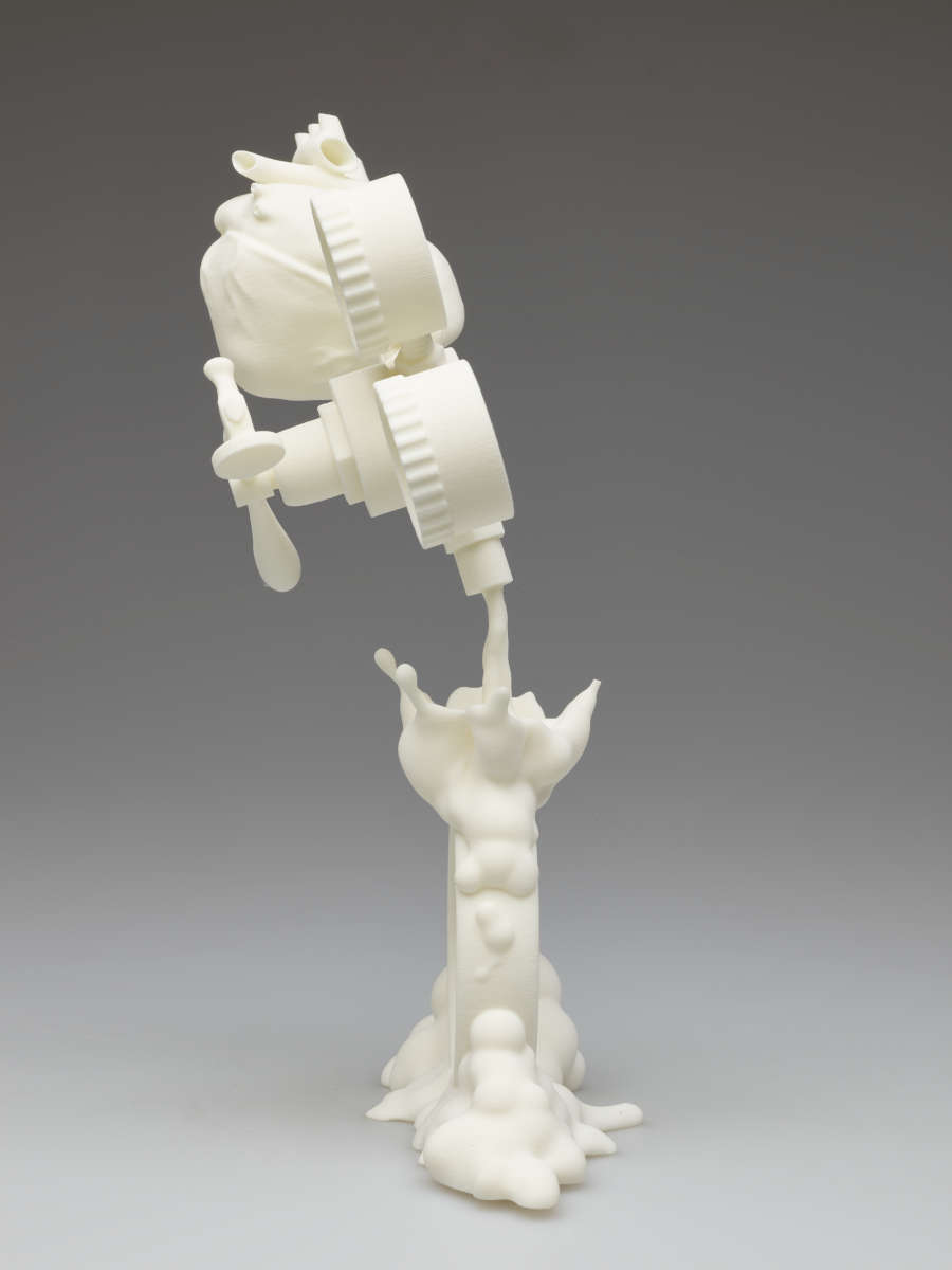 White plastic sculpture. At the top, tilted left, are mechanical objects with a valve that pours out a liquid-like form.