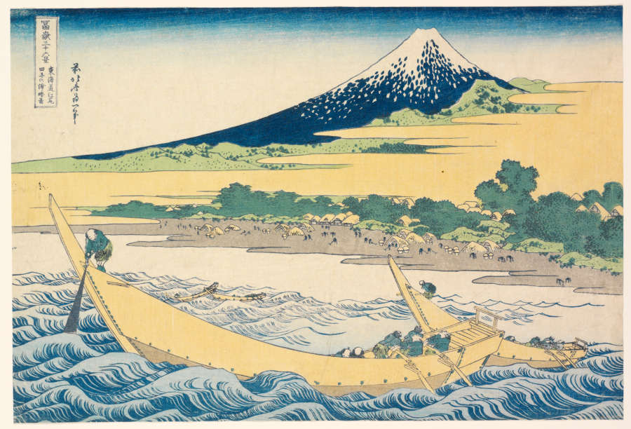Woodblock print depicting a scene of figures rowing large wooden tan boats on turbulent roiling waves with a crowded gray sand beach and a snow capped mountain in the background.