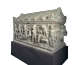 A deep-set, carved marble coffin adorned by a narrative with a seated central figure, and several mourning figures.