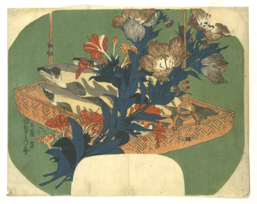 Woodblock print of a light brown woven basket brimming with light gray fresh fish topped with an exquisite arrangement of blooming red flower stalks covered in deep blue-green leaves.