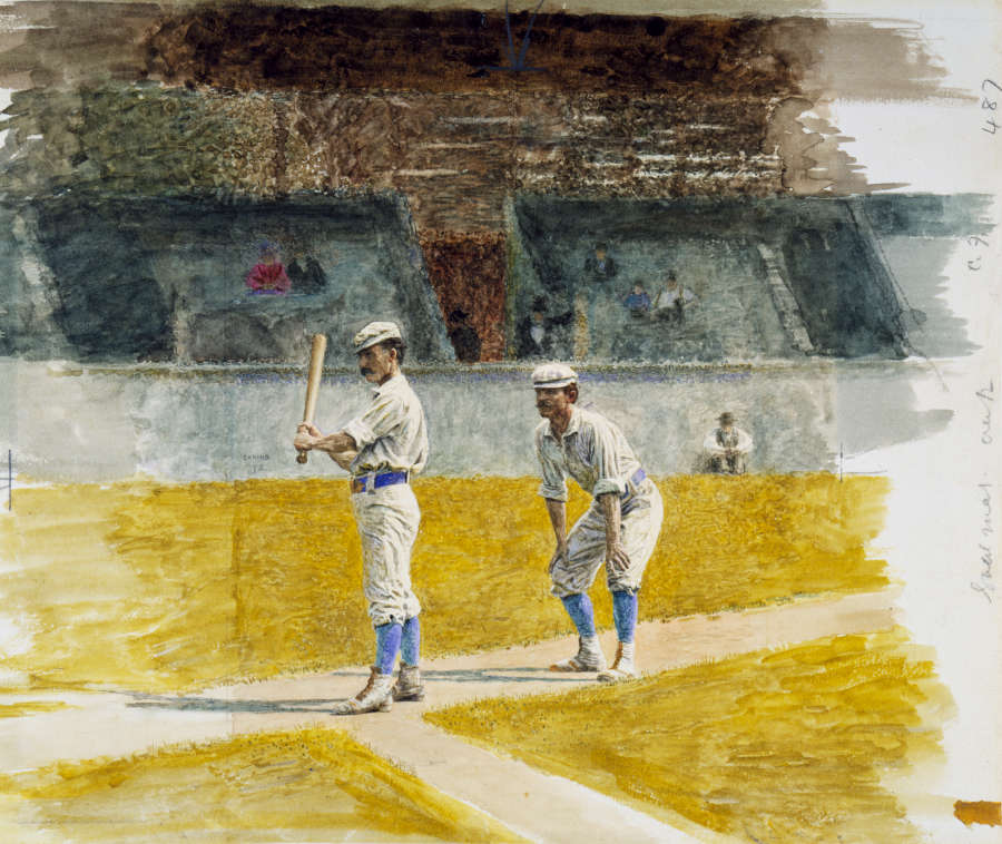 Two baseball players in old fashioned uniforms with blue socks stand on a dusty field with faded spectators in wooden bleachers. 