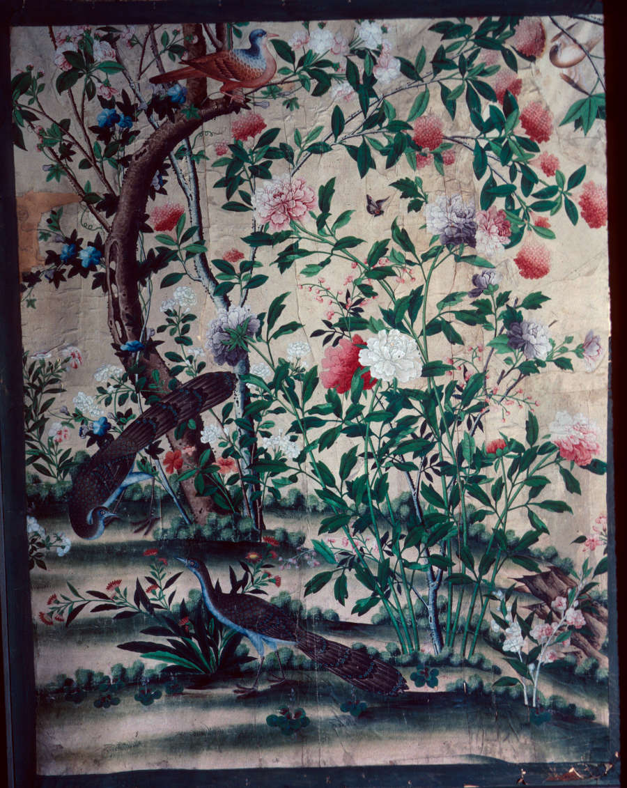 A shadowy composition intricately depicting dense foliage and colorful blossoms. Delicate butterflies and birds surround the scene, while a peacock a peacock or pheasant stands in the foreground. 