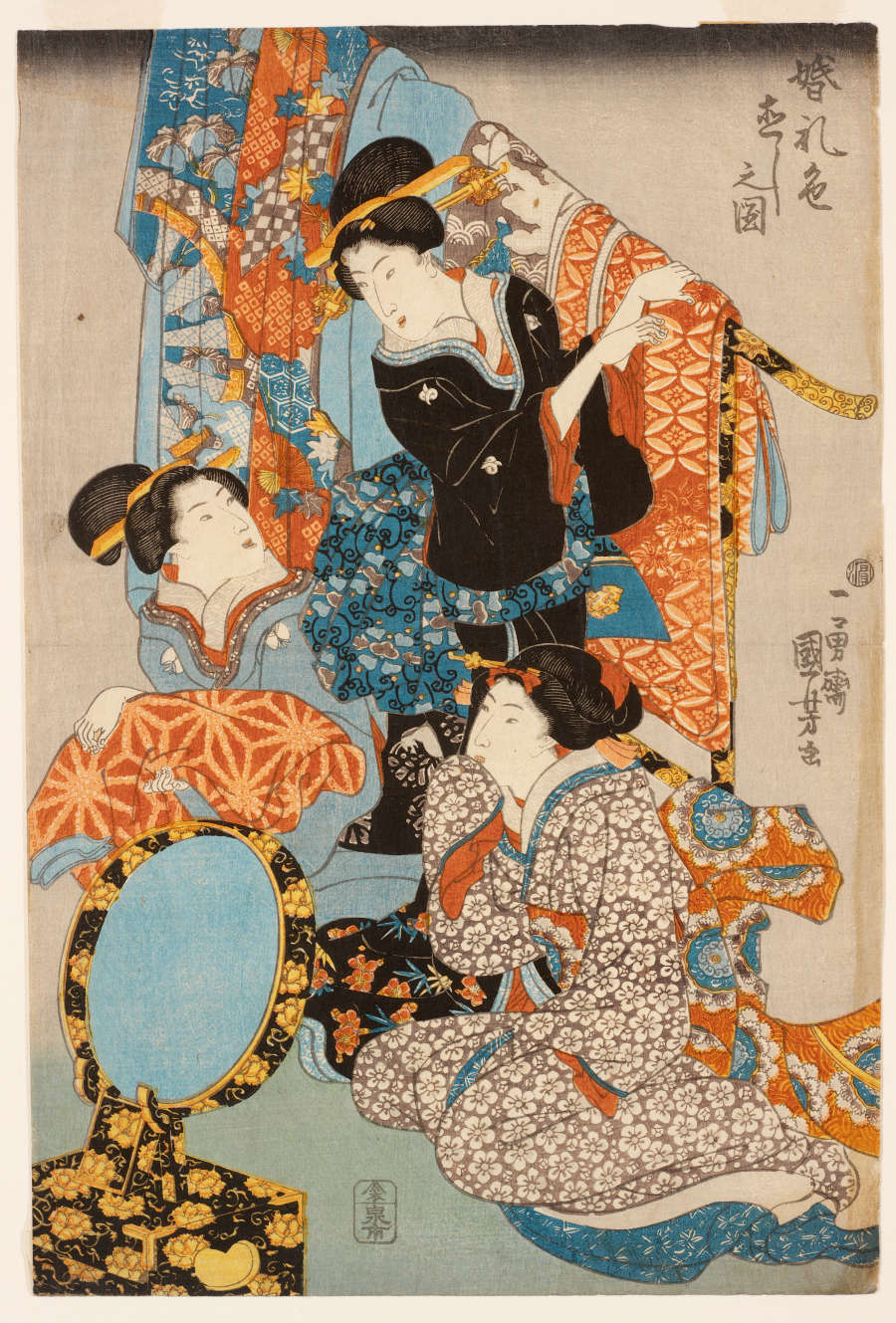 Traditional Japanese woodblock print of three women in intricate kimonos
folding vibrantly patterned fabrics. Two of the figures are looking at each other, while the other looks in a mirror.
