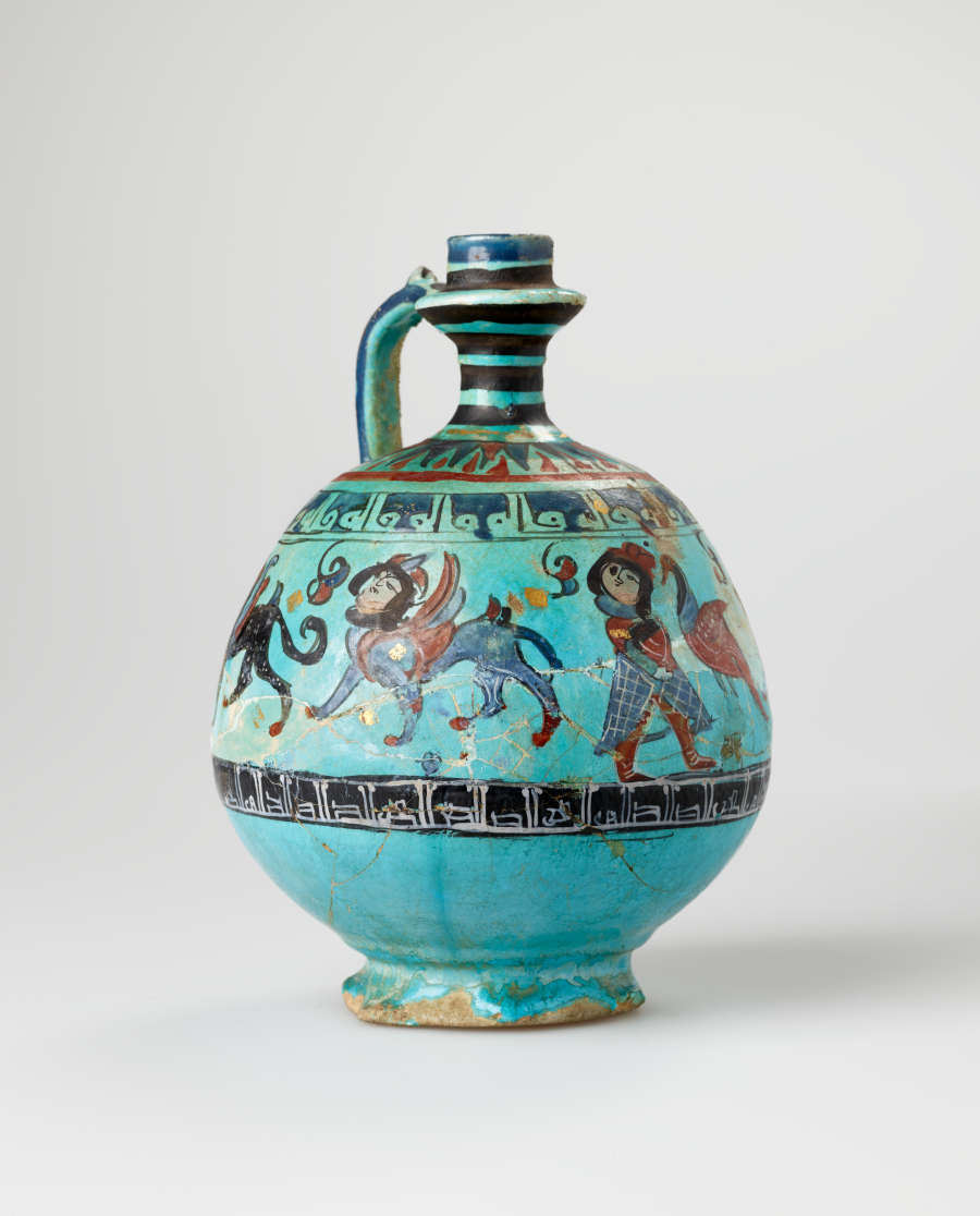 Bright turquoise jug with a spherical body and slender striped neck and handle. The jug’s body is decorated with illustrations of winged humanoid four-legged creatures and dark patterned stripes.