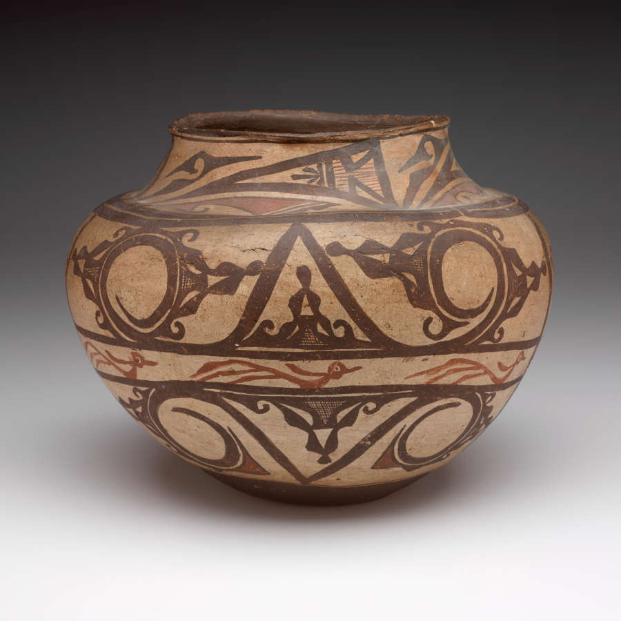 Off-white onion-shaped pot embellished with painted organic and geometric decorative stripes, featuring spiral and bird motifs, in deep browns and reds.