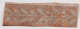 Horizontal decorative design on weathered, speckled orange surface featuring a faded white symmetrical leafy stem design below a light strip.