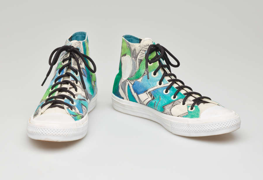 Stylish high top sneakers with a vibrant hand-painted blue, teal, and green fractured abstract design with contrasting black laces, set against a white background.