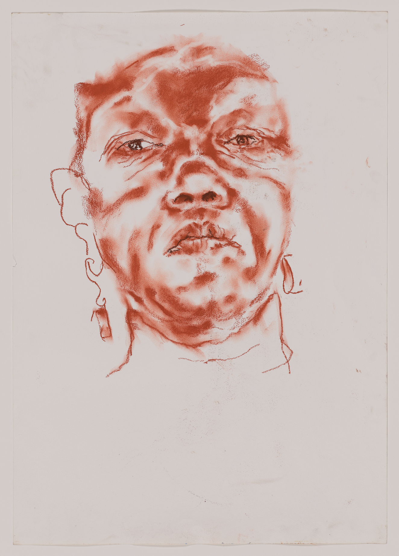 A regal portrait of a woman’s head done in red pastel. Her gaze is commandingand confident. The drawing is rendered using a spare amount of line and marks.